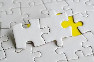 Jigsaw puzzle pieces removed from other jigsaw. Customizable space on jigsaw for text or ideas. Copy space concept photo