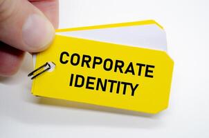 Corporate identity design idea highlighted on yellow sticky note for visual and verbal alignment. photo