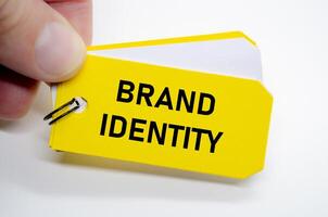 Brand identity note highlighted on yellow sticky, emphasizing core visual and verbal values. photo