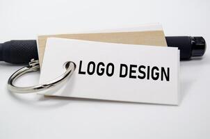 Logo design theme presented on white paper, showcasing identity creation and design element focus. photo