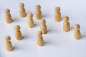 Top view of wooden dolls with customizable space for text or ideas. Leadership and copy space concept photo