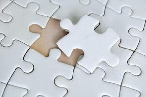 Symbol of partnership and unity shown through connected puzzle pieces. Partnering concept photo