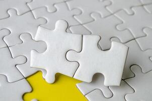 Jigsaw puzzle pieces removed from other jigsaw. Customizable space on jigsaw for text or ideas photo