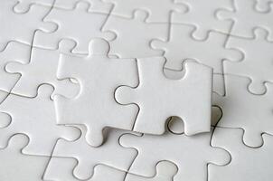 Close up of jigsaw puzzle pieces with customizable space on jigsaw for text or ideas. photo