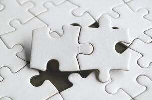 Connection of two puzzle parts in perfect harmony demonstrating logic clarity and teamwork in design photo