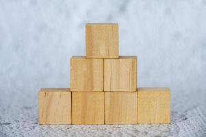 Close up of stacking wooden cubes with customizable space for text photo