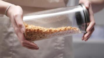 Glass cylindrical container with wax granules video