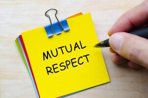 Mutual respect text on yellow sticky notes representing shared responsibility for workplace harmony photo