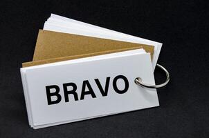 BRAVO text on white notepad. A Simple Gesture, A Powerful Message of Recognition and Encouragement. photo
