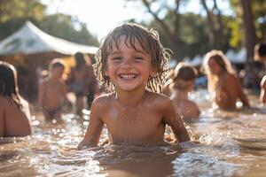 children playing in a shallow mud pool, splashing and laughing, with parents and festivalgoers relaxing nearby, bright sunlight creating a joyful, carefree atmosphere photo
