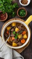 Delicious Beef Stew Recipe with Potatoes and Carrots in a Rustic Yellow Bowl photo
