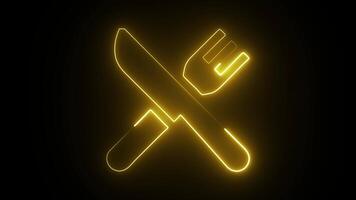 A glowing neon fork and knife in a cross shape against a dark black background. video