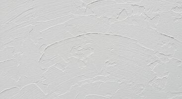 Subtle interplay of light and texture on a meticulously applied white wall photo