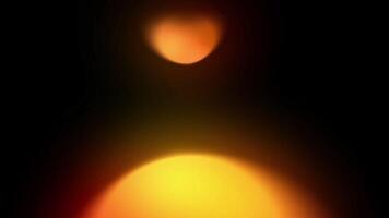 Two blurred lights on a black background. Ideal for abstract backgrounds, futuristic designs, technology concepts, and digital art projects. video
