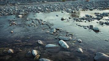 Slow Stream Flowing Water Between River Rocks In Relaxing Peaceful Nature video