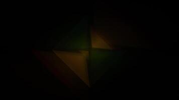 a black background with a green and yellow triangle video
