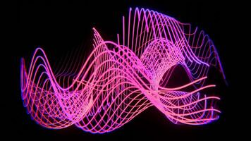 a neon colored object is shown in the dark video