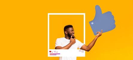 An enthusiastic social media influencer poses with a thumbs up against a bright yellow background. The cool design incorporates a frame, emphasizing online interaction and content creation. photo
