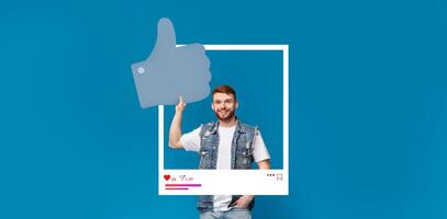 A young influencer confidently gives a thumbs up while standing in front of a vibrant blue background. The dynamic setting captures the essence of online content creation and community engagement. photo