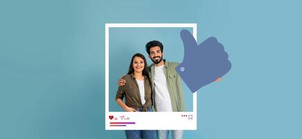 A happy couple stands together against a light blue background, giving a thumbs up. They encourage online interactions, showcasing positive vibes and content for influencers and bloggers. photo