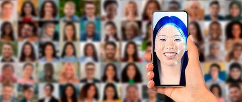 A hand holds a smartphone showing a face scan with a smiling individual. In the background, a collage of diverse faces represents modern identification technology in action. photo