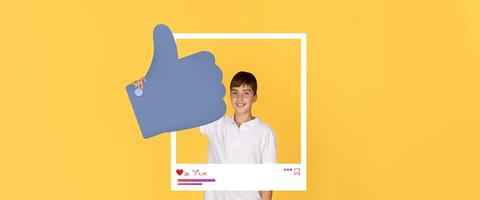 A cheerful boy shows a thumbs up gesture while posing in front of a colorful backdrop. His enthusiasm reflects the spirit of online engagement and influencer culture. photo