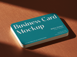Stacked Rounded Business Card Mockup on Copper Surface with Shadow psd