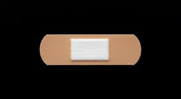 A bandage with a square patch on it photo