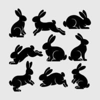 Set of rabbits silhouette in different poses. vector