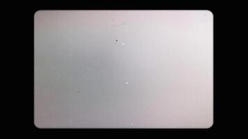 A vintage 35mm film frame with scratches, sprockets and dirt on a seamless loop that can be used as a background frame or composited as an overlay with a screen A vintage film strip frame texture video