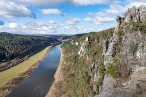 Aerial top down view to railway train and river cloudy day photo
