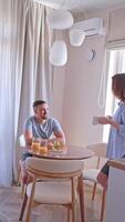 A husband and wife enjoying breakfast with fresh croissants and orange juice, creating treasured memories together. Concept. family gatherings, culinary arts, lifestyle magazines. video