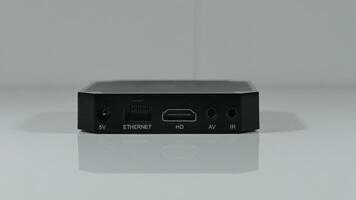 The back panel of a set top box with different connectors and slots for connection photo
