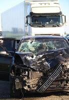 Consequences of a high-speed collision between a car and a truck on the highway photo