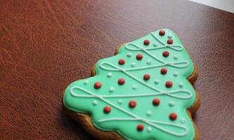 Pine Tree Cookie On Brown Leather Folder Concept Photo For New Year Business Greeting
