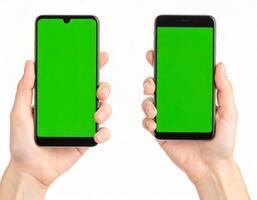 Hand holding a phone with an empty chroma key screen for mockup use on white backdrop photo