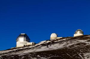 Mauna Kea, HI, 2011 - Observatory Buildings Against Clear Blue Sky photo