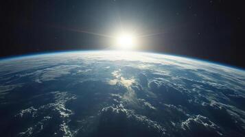 Sunrise over Earth from space with cloud cover and dark starry sky creating peaceful cosmic view photo