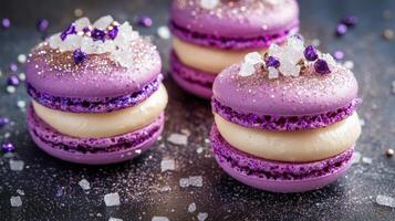 Purple macarons with white cream filling and crunchy sugar crystals on dark surface. Festive and detailed close-up of classic French dessert photo
