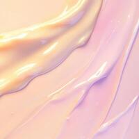 Delicate swirls of pale peach and light pink cosmetic cream spread across the frame. Its shiny, smooth surface reflects light, emphasizing the luxurious feel of the skincare product photo