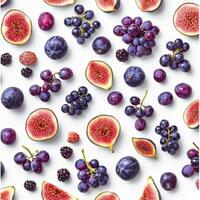 Overhead arrangement of figs, purple grapes, plums, and blackberries on a white background, showcasing a dark and rich selection of fresh, ripe fruit photo