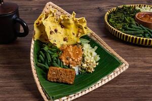 Authentic Javanese Pecel in Triangular Bamboo Plate photo
