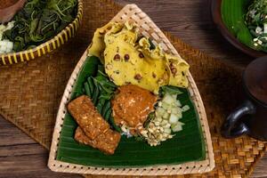 Authentic Javanese Pecel in Triangular Bamboo Plate Isolated photo