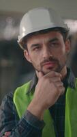 Thoughtful Caucasian guy foreman builder thinking in construction contractor contemplation puzzled technician man deciding male electrician think solution building project problem architect brainstorm video