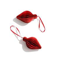 Red Christmas paper bauble as shape flashlight isolated on white background. Scandinavian Christmas honeycomb ornaments. New year paper decor, Modern xmas decoration, minimal winter holiday, top view photo
