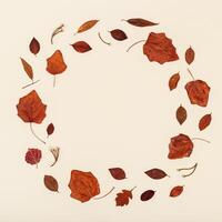 Autumn round frame from colorful autumn leaves on neutral beige background with copy space. Fall time concept. photo