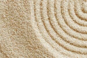Smooth simple Lines on sand background, minimal aesthetic sandy texture. Spa, meditation, relaxation, wellness concept. Natural beige waves pattern in Japanese zen garden. View from above photo