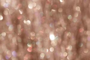 Vibrant abstract image with soft-focus mocha mousse bokeh light patterns with shimmering highlights, festive texture background, blurred backdrop trend color year 2025, sunlight glare on brown beige photo