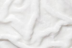 White Faux Fur Texture, Soft, white artificial fur with fluffy texture and gentle shadows. Close-up textile background delicate textures, top view, copyspace, backdrop with soft folds photo