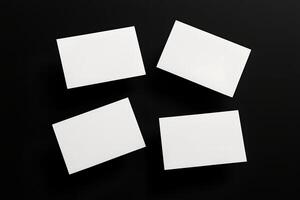 Floating Business Card Mockups with Blank Fronts Isolated on Black photo